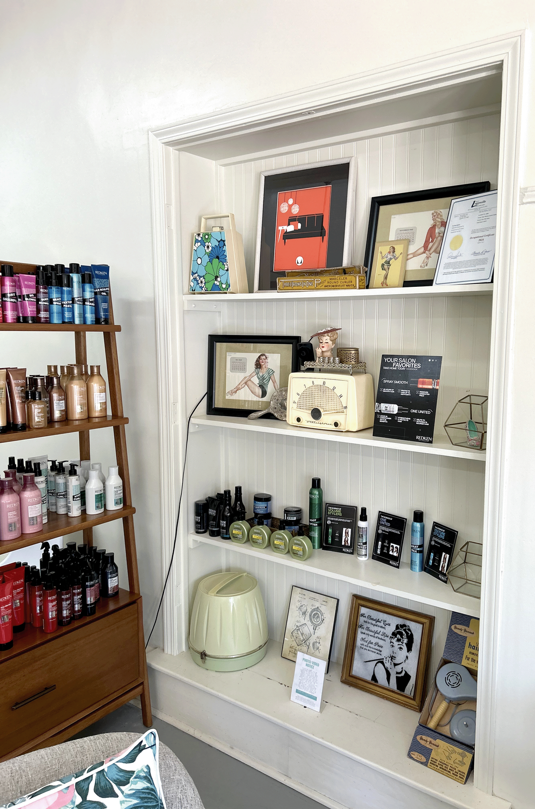 Built-in shelves with hair products a 1950's vintage decor